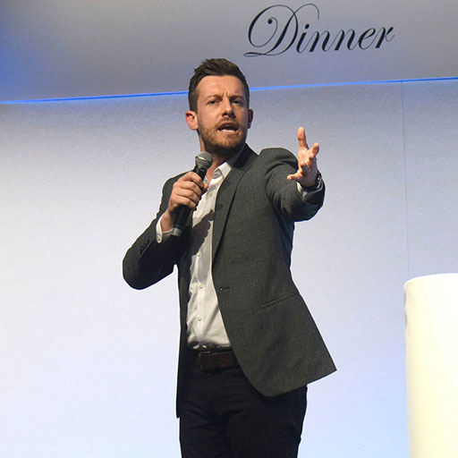 Chris Ramsey performing at a function