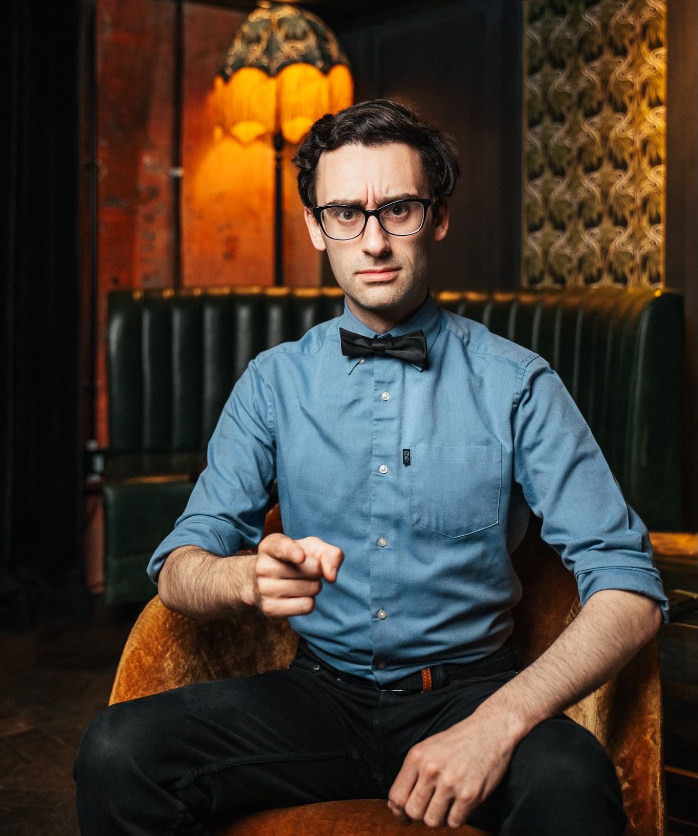 MC Hammersmith smiles in a professional headshot, wearing a dark jacket against a neutral background.